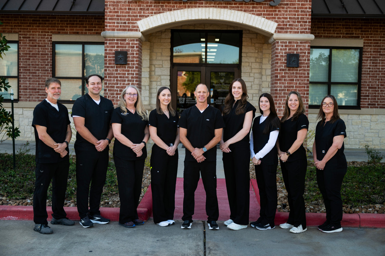 The Magnolia Pharmacy team of nine compounding pharmacists outside the Magnolia, Texas pharmacy